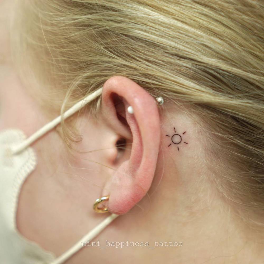 sun ear tattoo