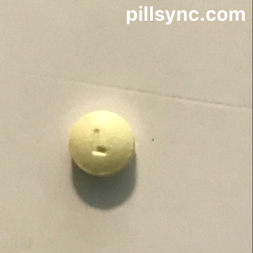 yellow round pill with l