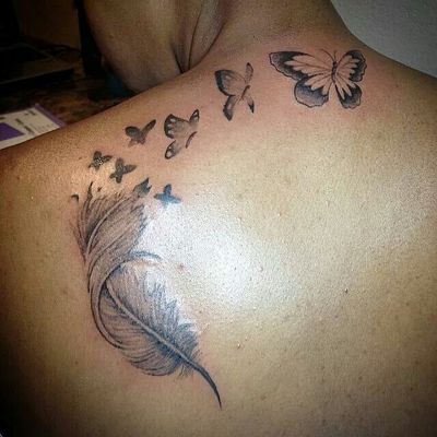 feather tattoo with butterflies