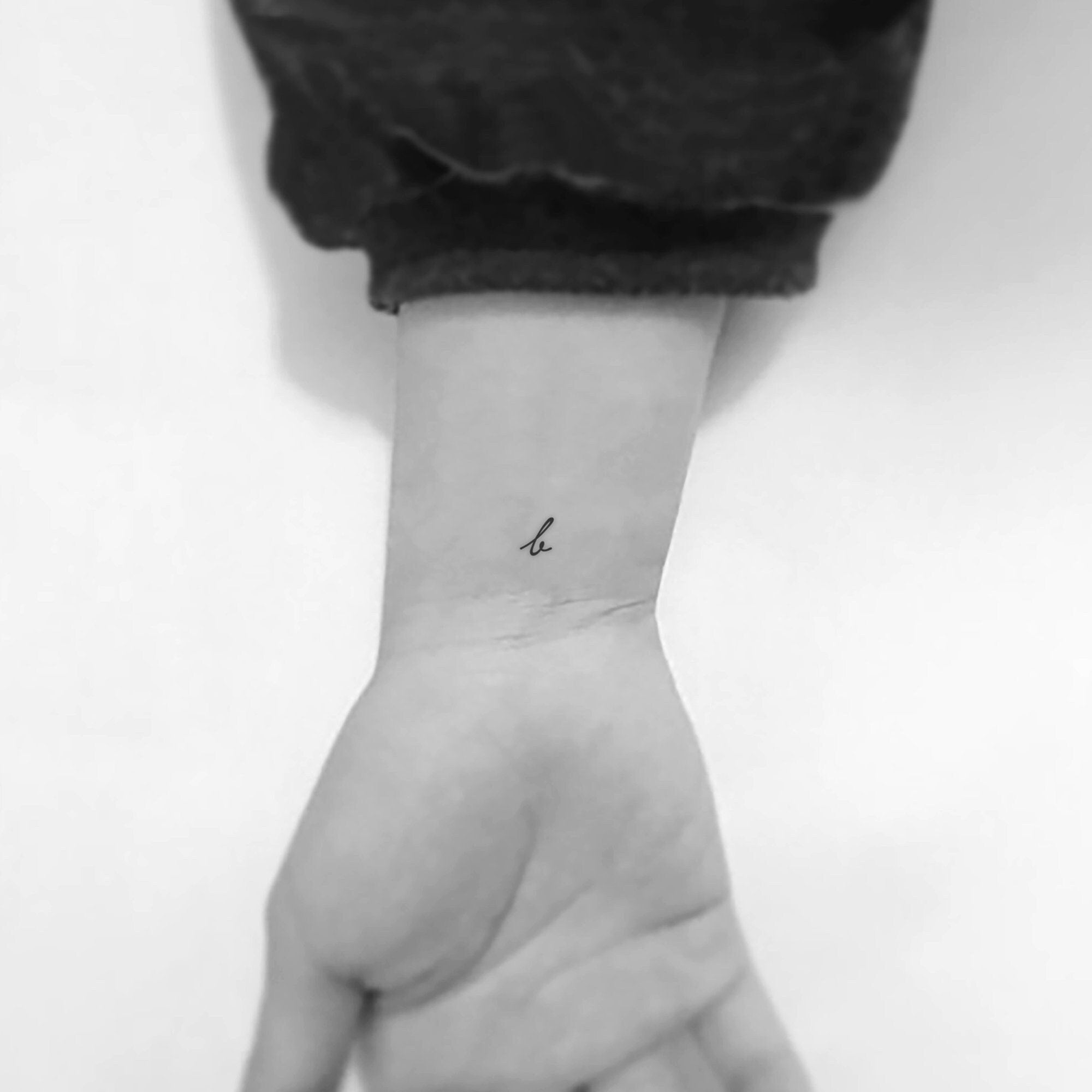 letter b tattoo on wrist