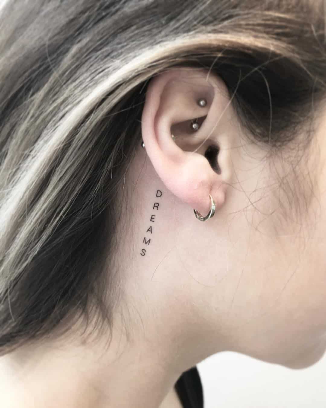 back of earlobe tattoo