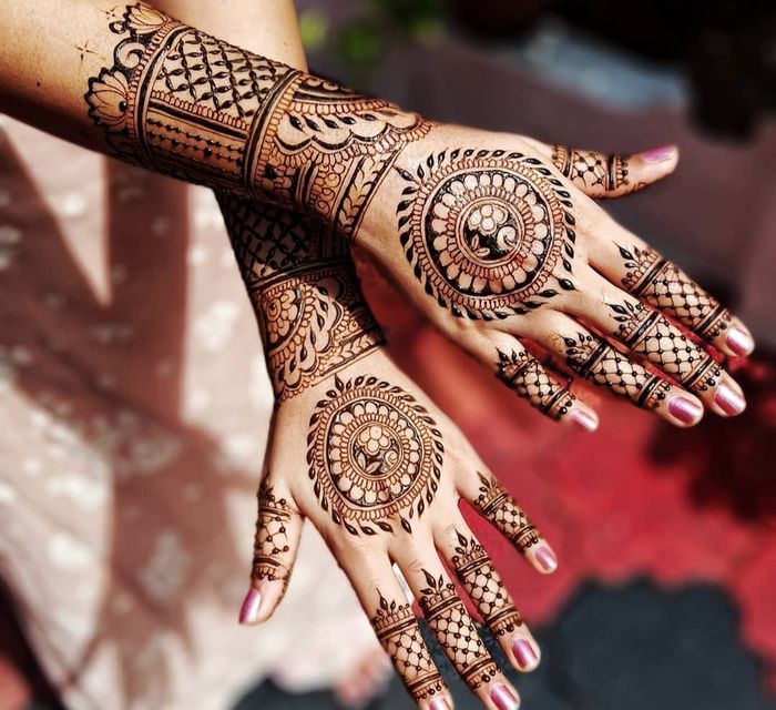 mehndi design behind hand