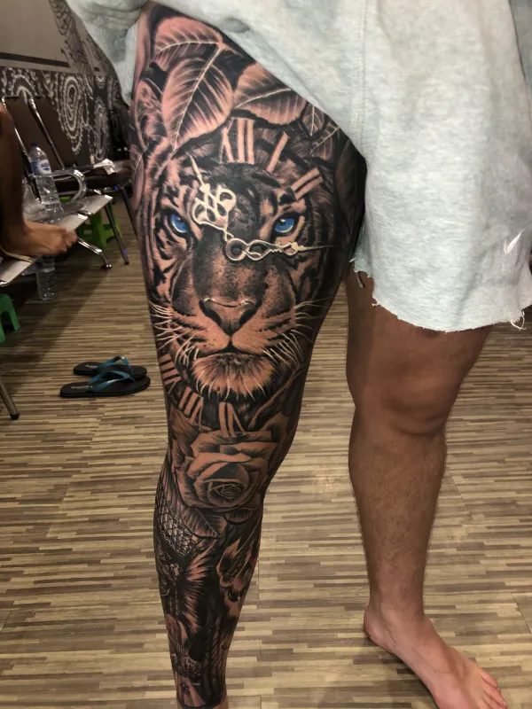 upper leg tattoos for guys