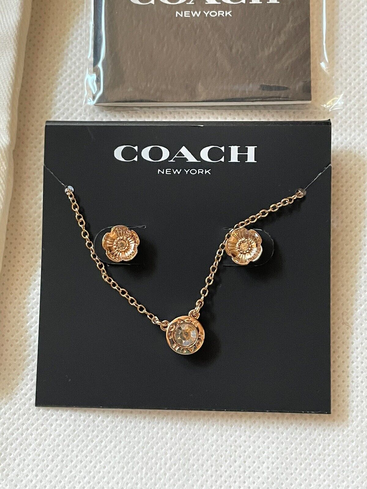 coach necklace rose gold