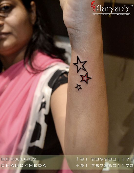 star tattoo on side wrist