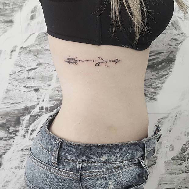 arrow rib tattoo