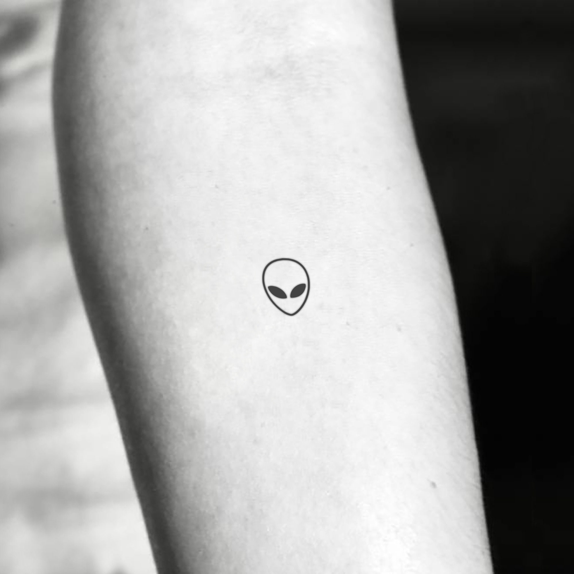 alien logo tattoo