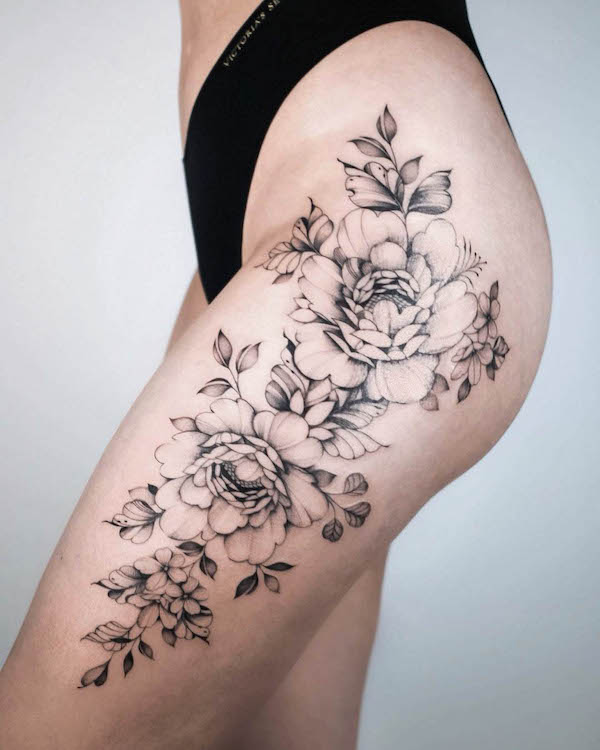 floral tattoo on thigh