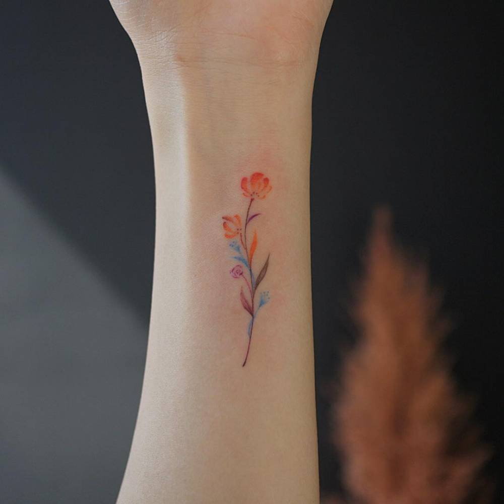 small watercolor flower tattoo